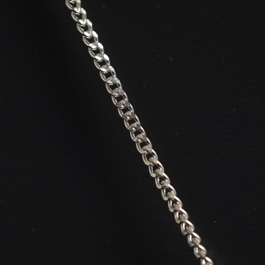 a close up of a chain on a black background