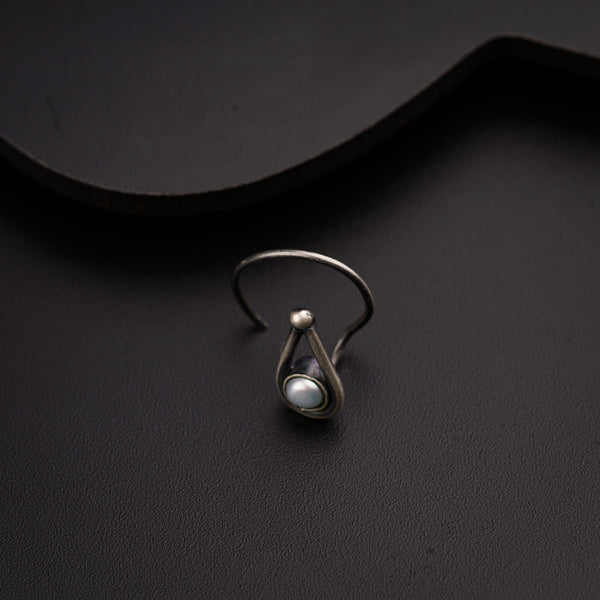 a close up of a ring on a black surface
