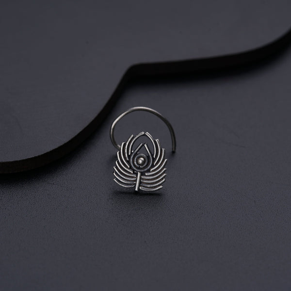 a close up of a ring on a black surface