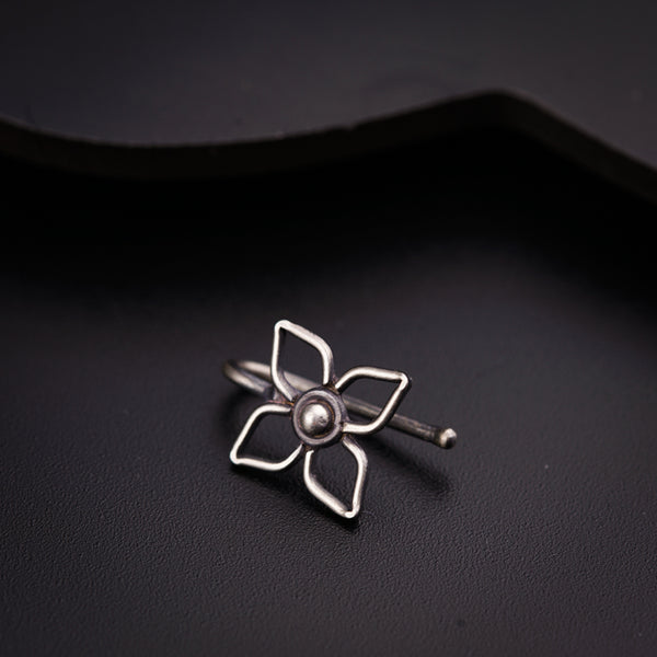 a silver ring with a flower on it
