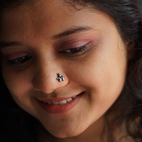 a close up of a person with a nose piercing