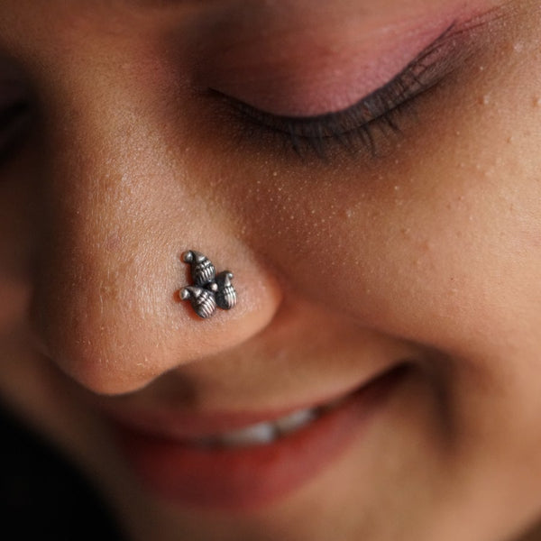 a close up of a person with a nose piercing