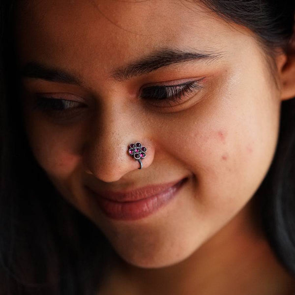 a close up of a person with a nose piercing