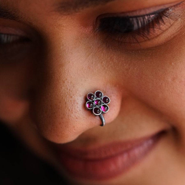 a close up of a person with a nose piercing