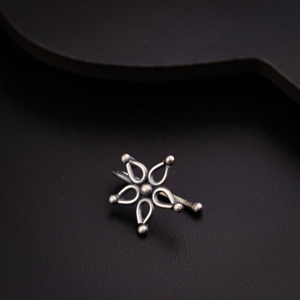 a close up of a metal object on a black surface