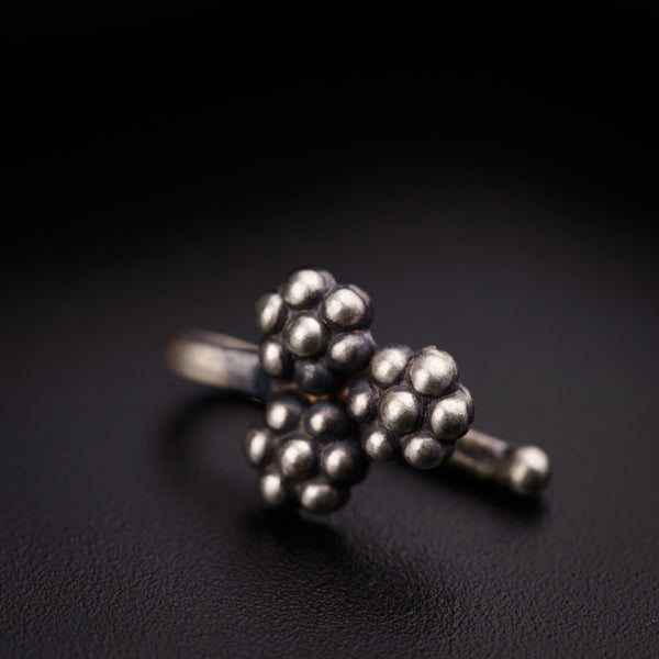 a close up of a ring on a black surface