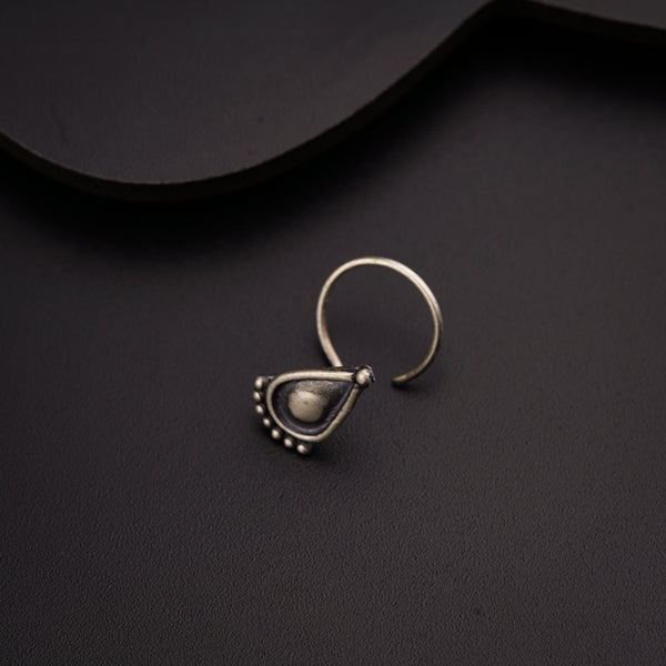 a close up of a ring on a black surface