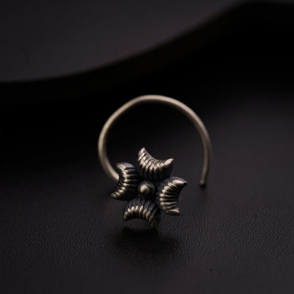 a close up of a ring on a black surface