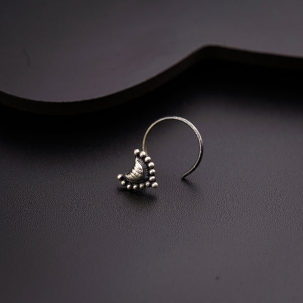 a close up of a pair of earrings on a table