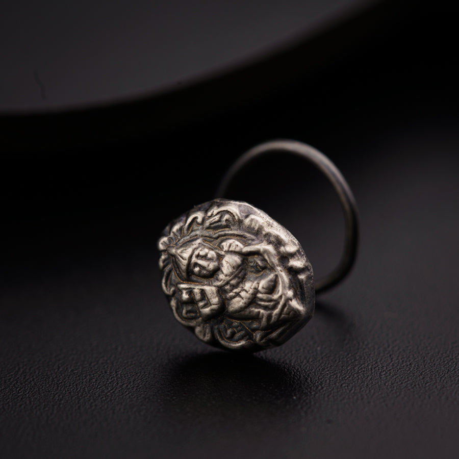 a silver ring with a lion head on it