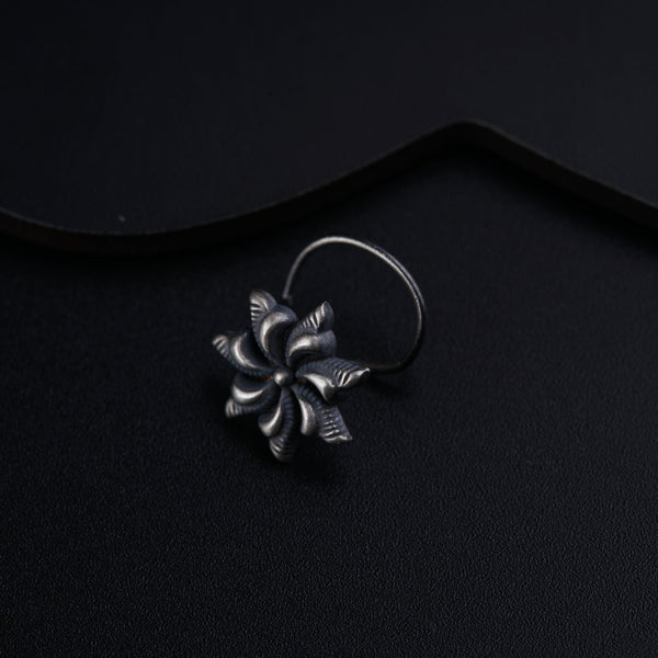 a close up of a ring on a black surface
