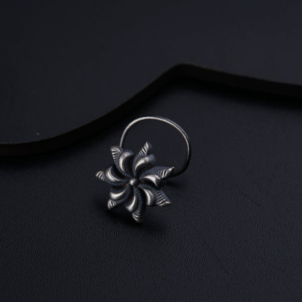 a close up of a ring on a black surface