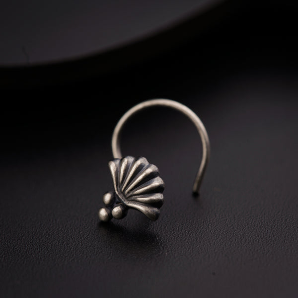 a close up of a ring on a black surface