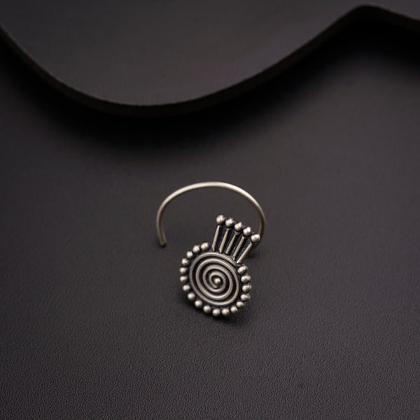 a close up of a pair of earrings on a table