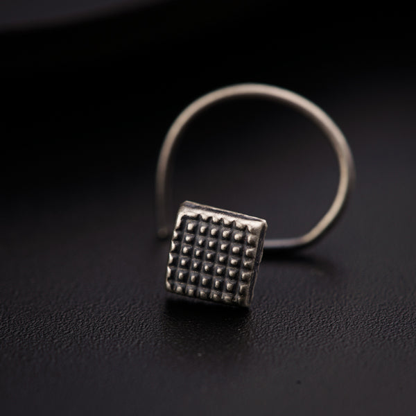 a silver ring with a square design on it