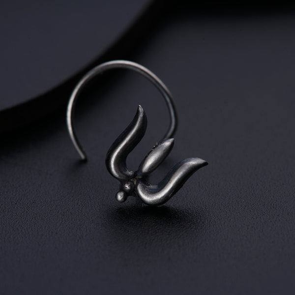 a close up of a metal object on a black surface