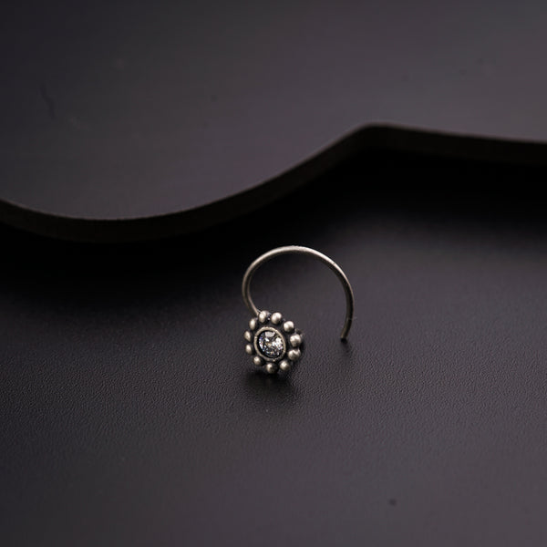 a close up of a ring on a black surface