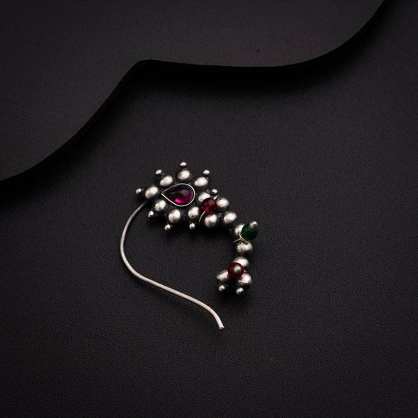 a close up of a necklace on a black surface