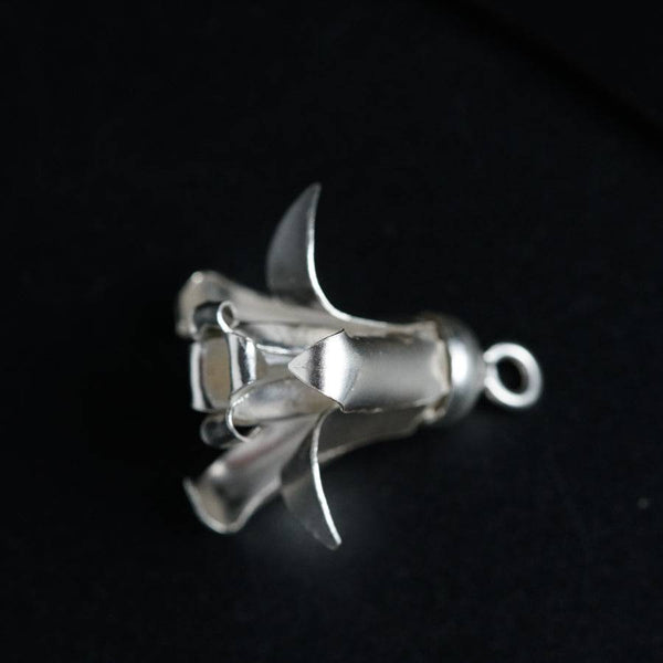 a metal object on a black surface