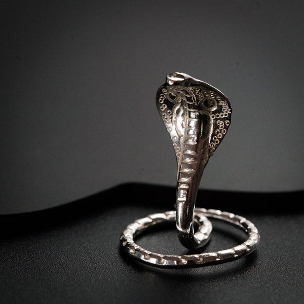 a silver ring with an elephant head on it
