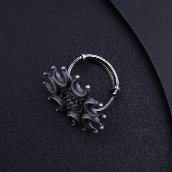 a close up of a ring on a black surface