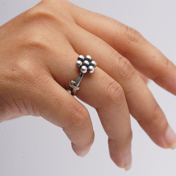 a woman's hand with a ring on it