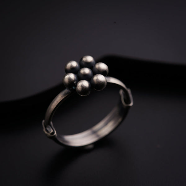 a close up of a ring on a black surface