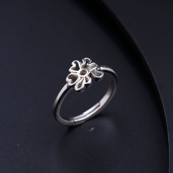 a close up of a ring on a black surface