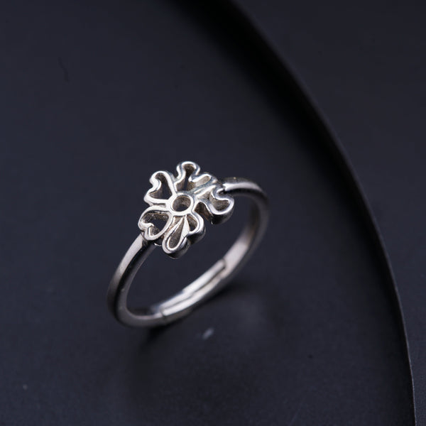 a close up of a ring on a black surface