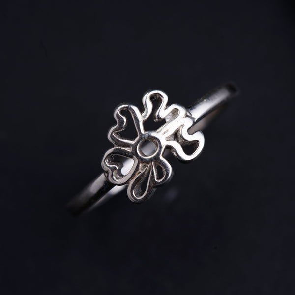 a close up of a ring on a black surface