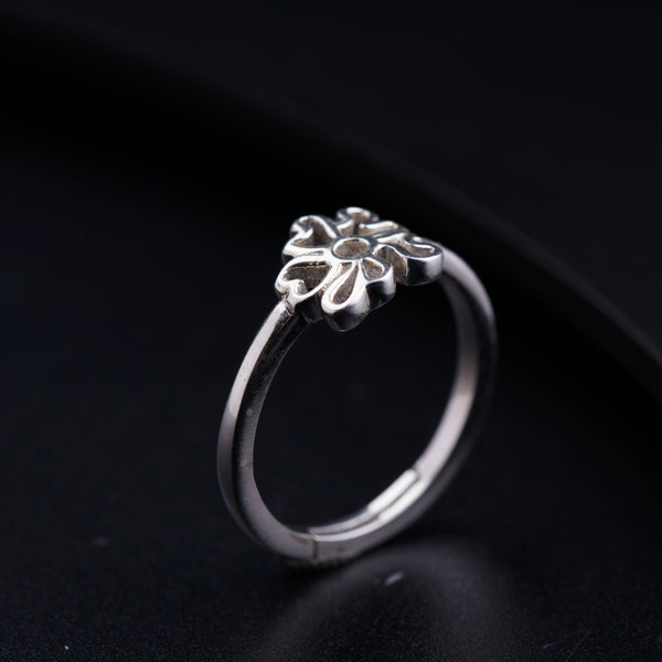 a close up of a ring on a black surface