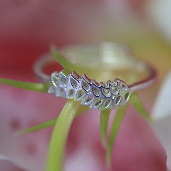 a close up of a ring on a flower