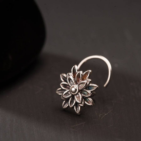 a close up of a pair of earrings on a table