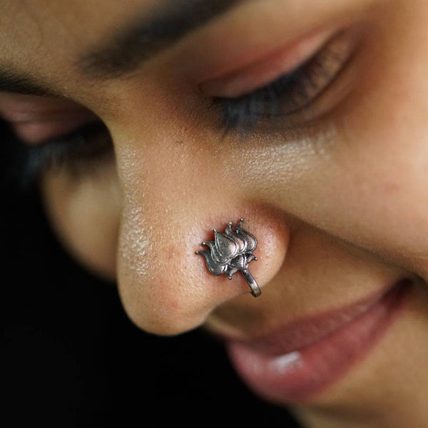 a close up of a person with a nose piercing