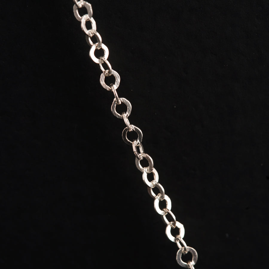a close up of a chain on a black background