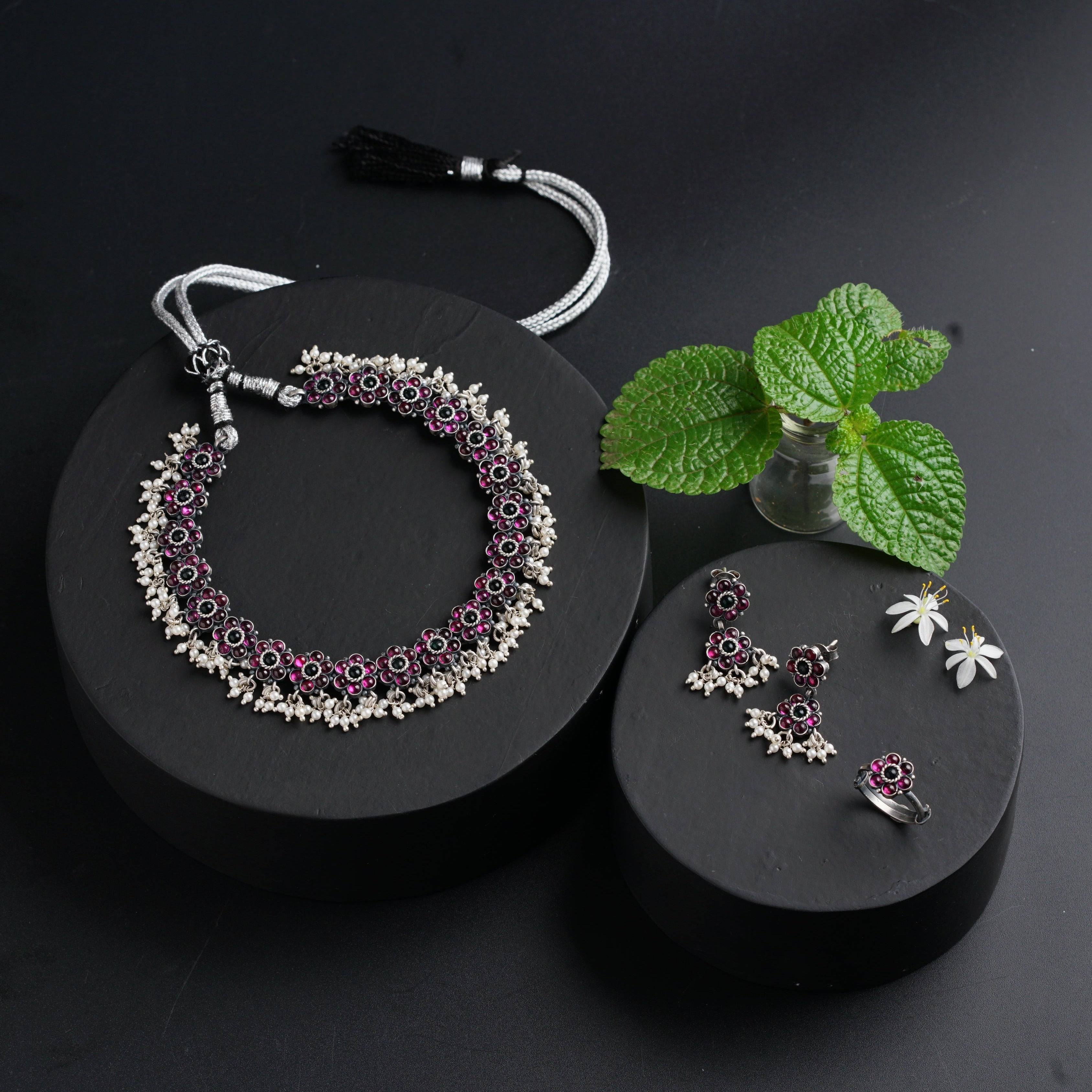 a pair of jewelry sits on a black surface