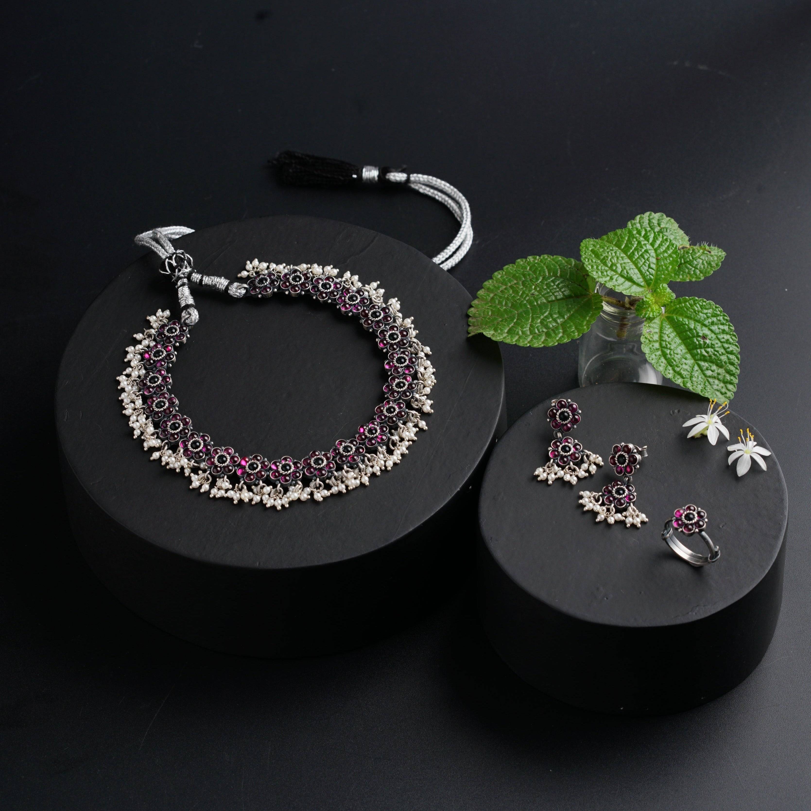 a pair of jewelry sits on a black surface