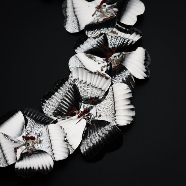 a black and white photo of paper flowers