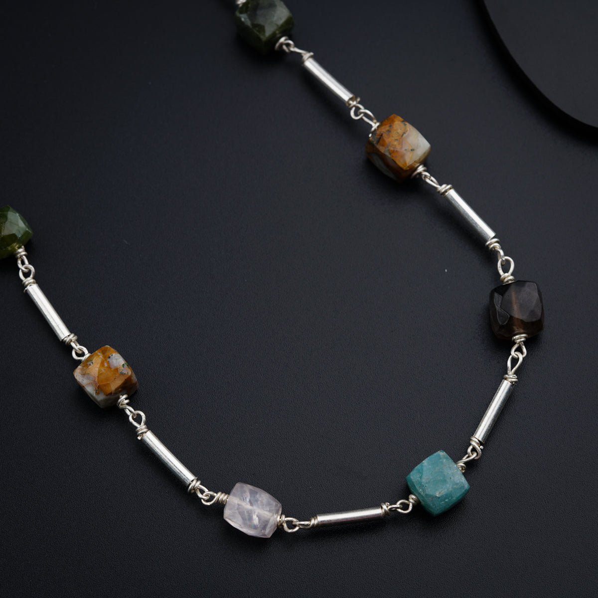 Silver pipe necklace with multicolored stones