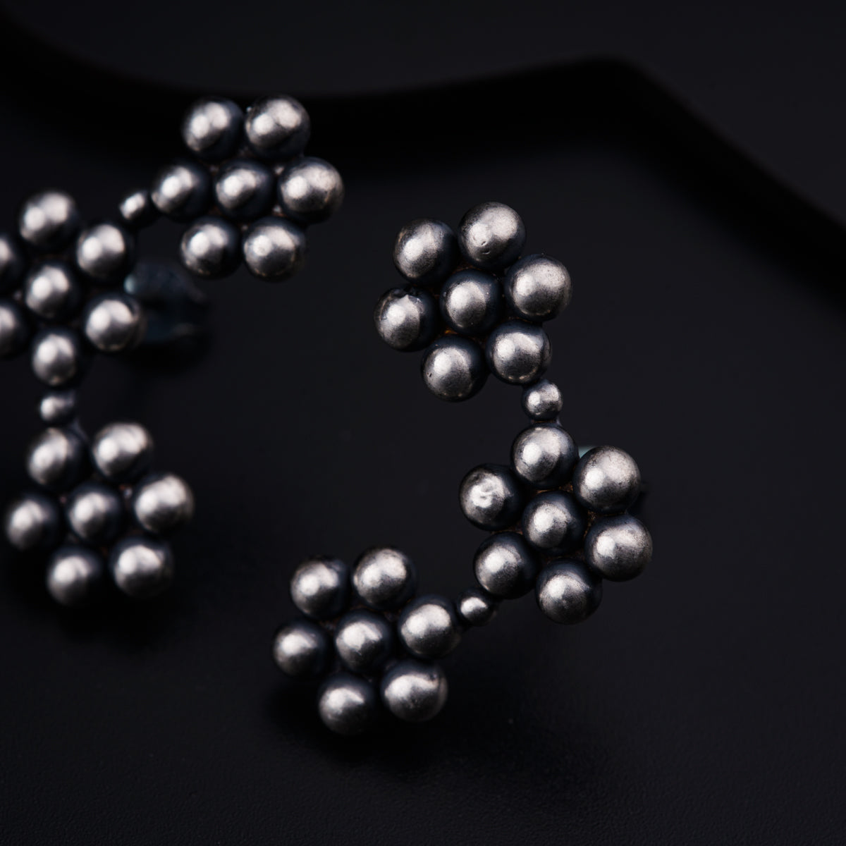 a close up of a bunch of balls on a black surface