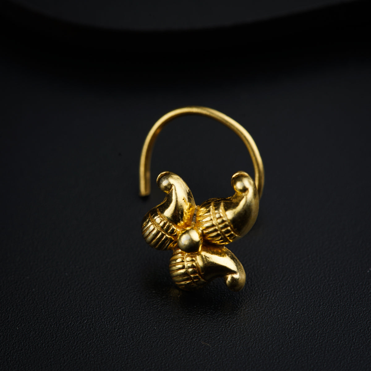 a gold ring with an elephant on it