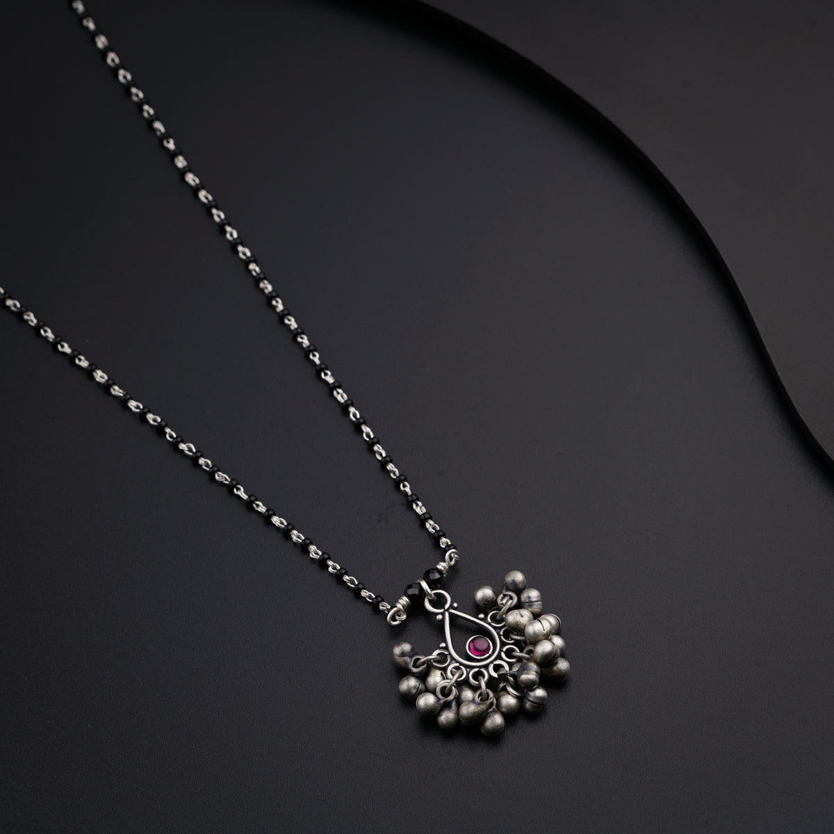 a necklace with a flower design on it
