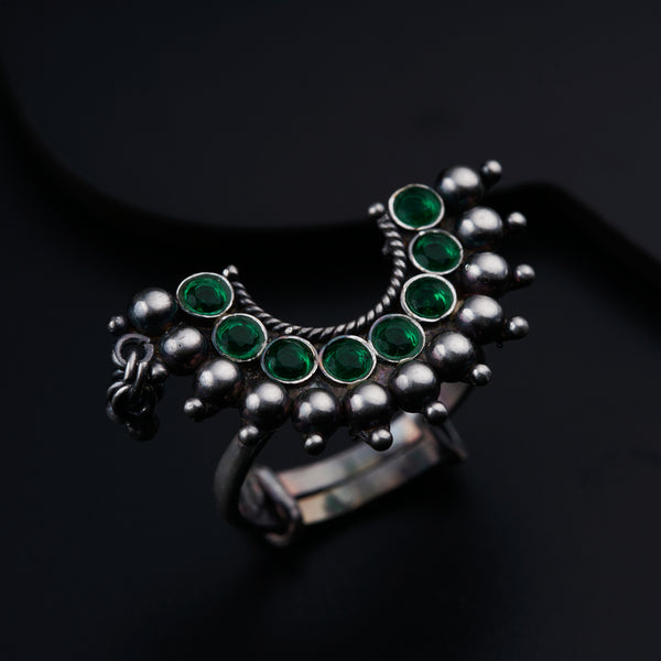 a close up of a ring on a black surface