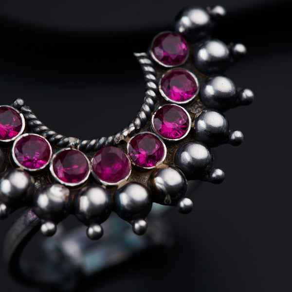 a close up of a ring on a black surface