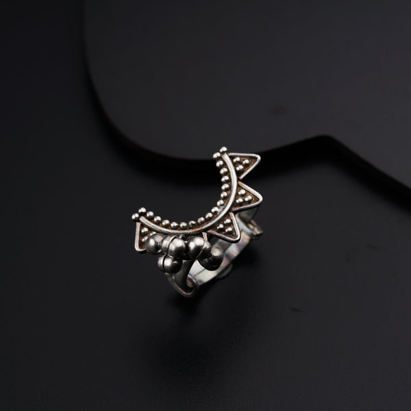 a close up of a ring on a black surface