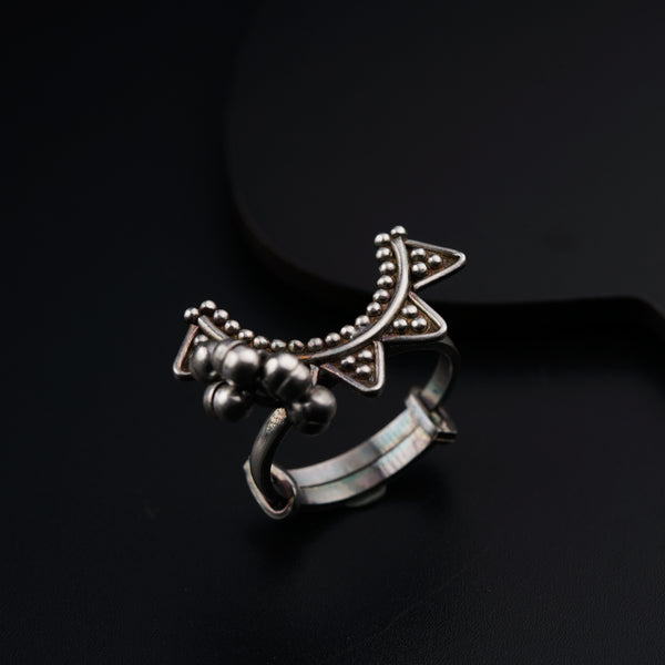 a close up of a ring on a black surface