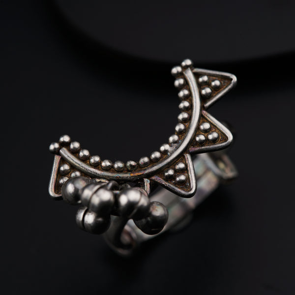 a close up of a ring on a black surface