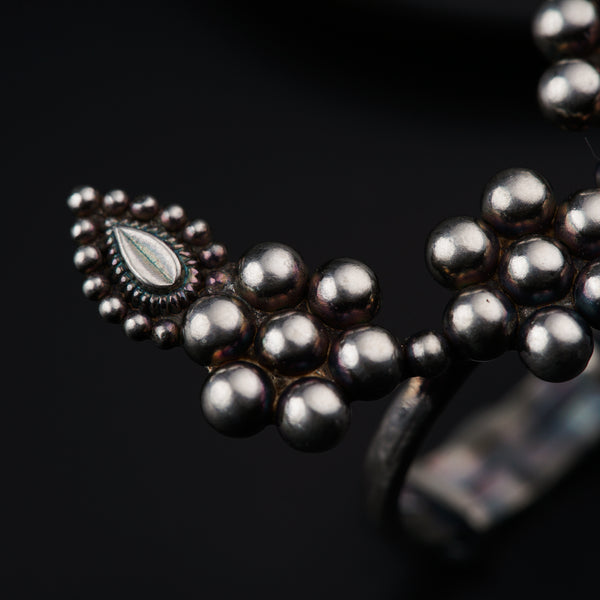 a close up of a ring on a black surface