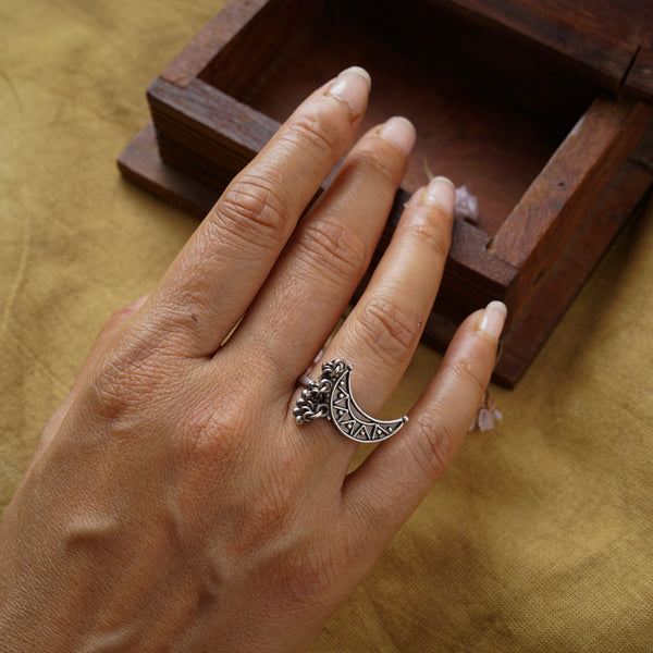 a woman's hand with a ring on it