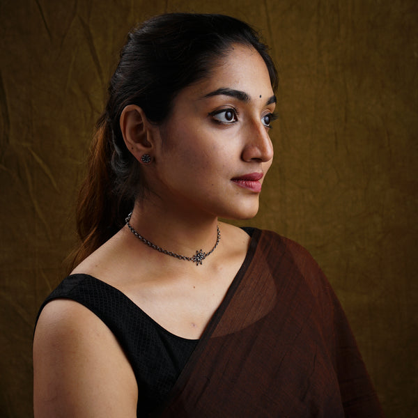 a woman in a black top is posing for a picture